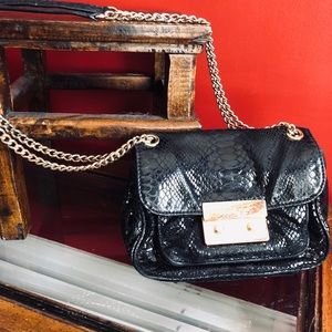 Michael Kors cross body leather embossed bag